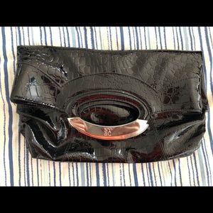 A cute black patent clutch